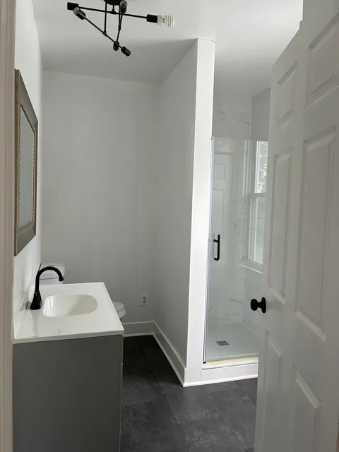 Walk-in shower and vanity — Finished surfaces